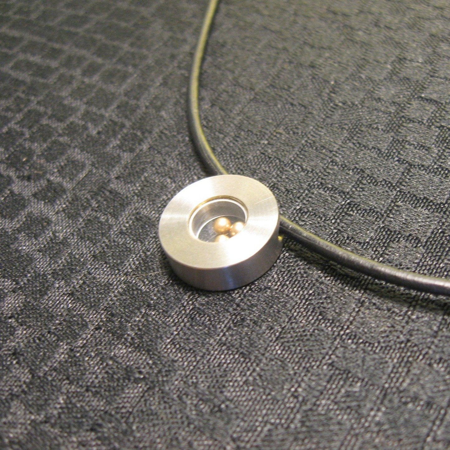 Titanium Pendant on a black Leather Cord - NIB